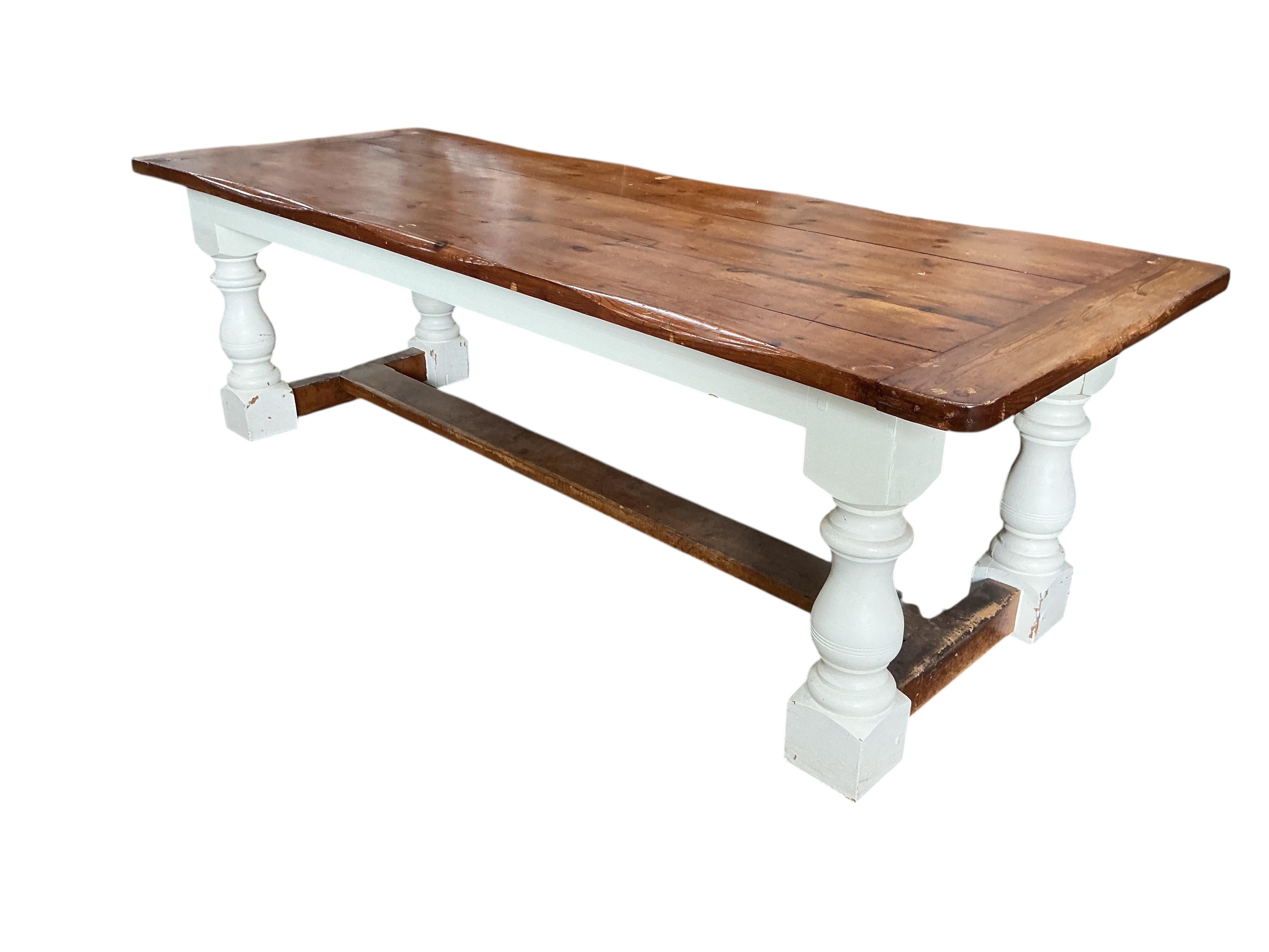 An 18th century style part painted rectangular pine refectory dining table, width 241cm, depth 92cm, height 74cm